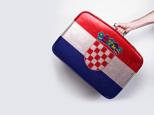 Croatia flag on a vintage leather suitcase.